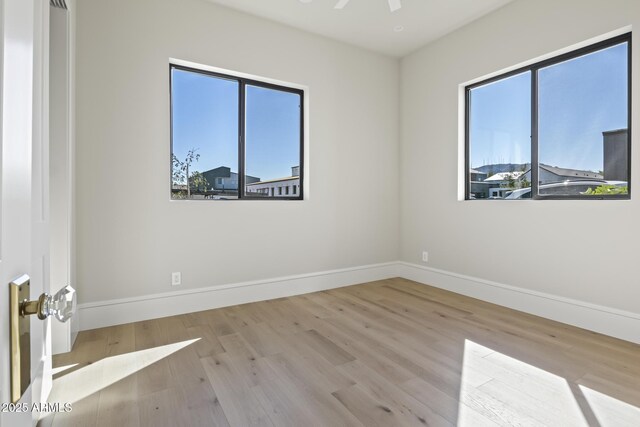 8503 S 9th Dr Unit 17, Phoenix, AZ 85041 - unfurnished room with wood finished floors and baseboards