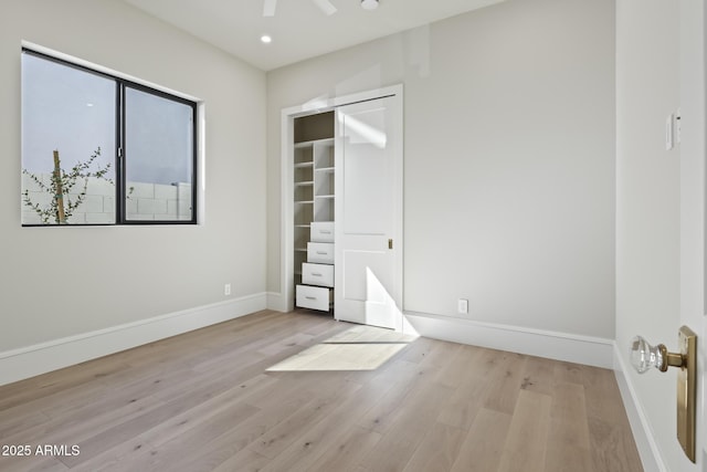 8503 S 9th Dr Unit 17, Phoenix, AZ 85041 - unfurnished bedroom featuring wood finished floors, baseboards, and recessed lighting
