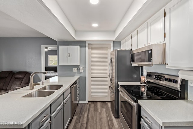 520 N Stapley Dr Unit 256, Mesa, AZ 85203 - kitchen featuring stainless steel appliances, a sink, dark wood-style flooring, light countertops, and white cabinets