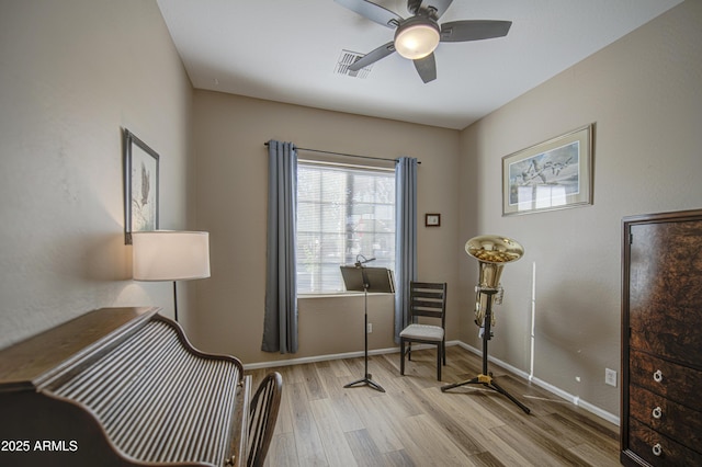 25659 W Forest Grove Ave, Buckeye, AZ 85326 - living area featuring wood finished floors, ceiling fan, and baseboards