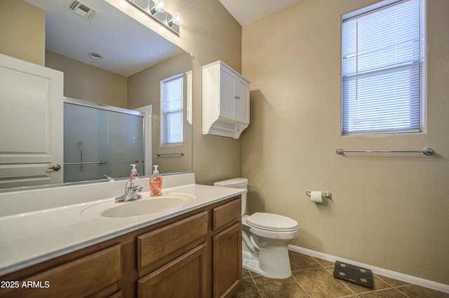 25659 W Forest Grove Ave, Buckeye, AZ 85326 - full bath with vanity, a shower with door, toilet, baseboards, and tile patterned floors