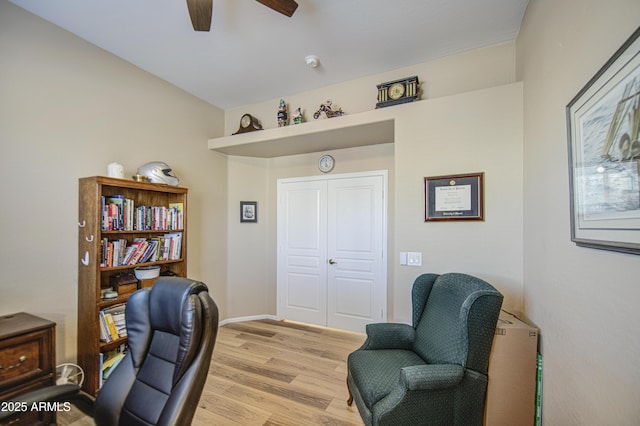 25659 W Forest Grove Ave, Buckeye, AZ 85326 - office area featuring light wood finished floors, a ceiling fan, and baseboards