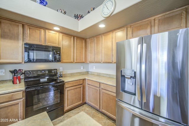 25659 W Forest Grove Ave, Buckeye, AZ 85326 - kitchen with black appliances, light countertops, light tile patterned floors, and recessed lighting