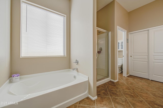 25659 W Forest Grove Ave, Buckeye, AZ 85326 - bathroom with toilet, a garden tub, a stall shower, baseboards, and tile patterned flooring