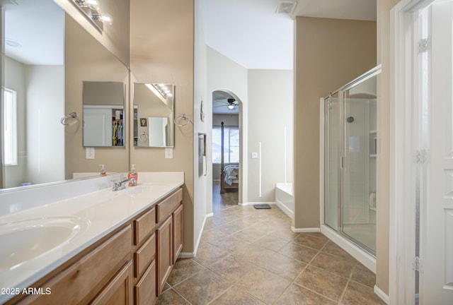 25659 W Forest Grove Ave, Buckeye, AZ 85326 - full bath with double vanity, a shower stall, ceiling fan, and connected bathroom