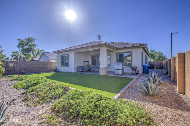 25659 W Forest Grove Ave, Buckeye, AZ 85326 - back of property with stucco siding, a tile roof, and a patio area