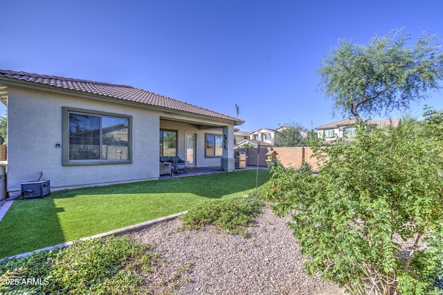 25659 W Forest Grove Ave, Buckeye, AZ 85326 - back of property featuring a tile roof, stucco siding, and a patio