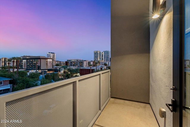 view of balcony at dusk