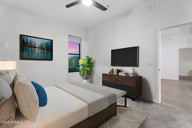 bedroom featuring ceiling fan and light hardwood / wood-style floors