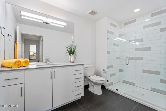full bathroom featuring a stall shower, tile patterned floors, toilet, vanity, and visible vents