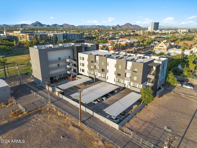 birds eye view of property with a mountain view