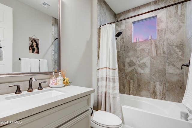 full bathroom featuring toilet, vanity, and shower / bath combo with shower curtain