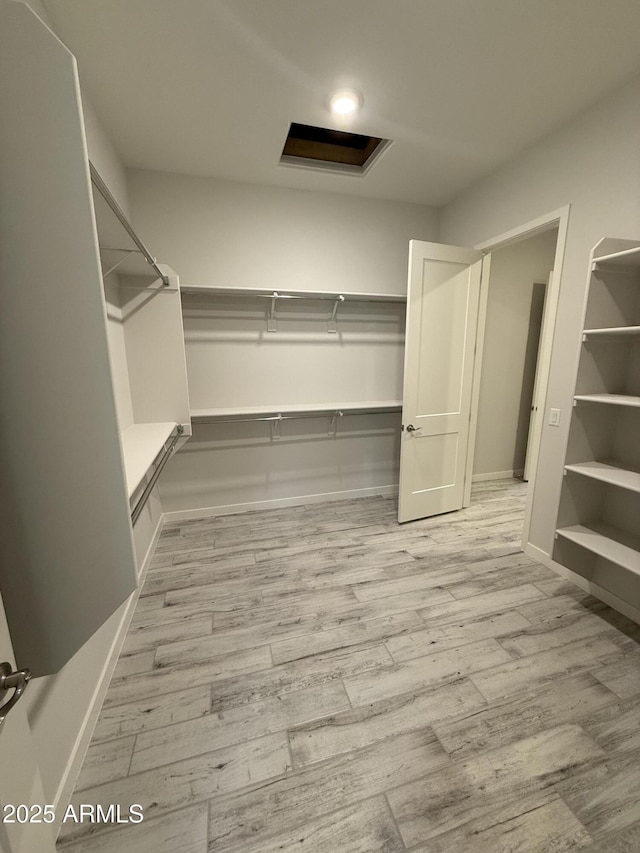17324 W Royal Palm Rd, Waddell, AZ 85355 - walk in closet featuring wood finished floors