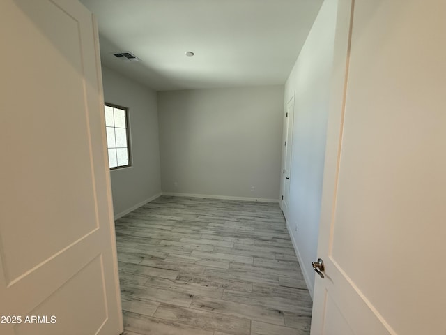 17324 W Royal Palm Rd, Waddell, AZ 85355 - unfurnished room with light wood-type flooring and baseboards