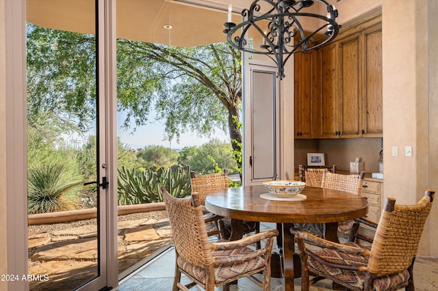 dining space featuring a notable chandelier