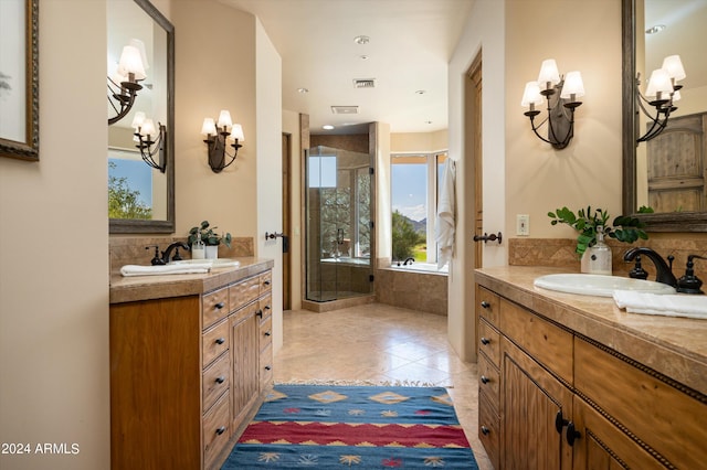 bathroom featuring independent shower and bath, vanity, and tile patterned floors