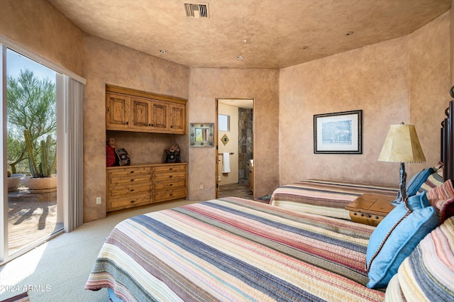 carpeted bedroom featuring access to outside