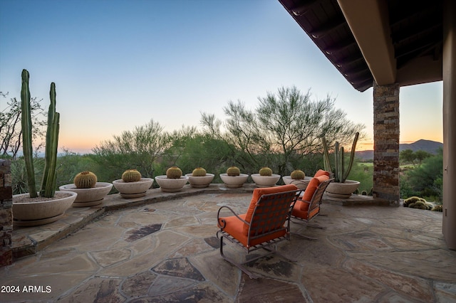 view of patio terrace at dusk