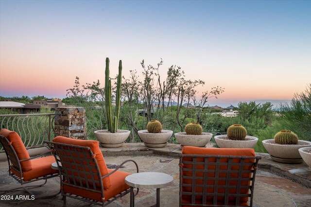 view of patio terrace at dusk