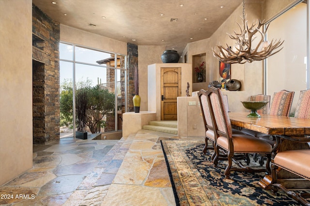 dining area with an inviting chandelier