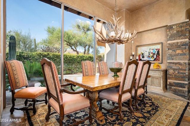 dining room with a notable chandelier and wood-type flooring