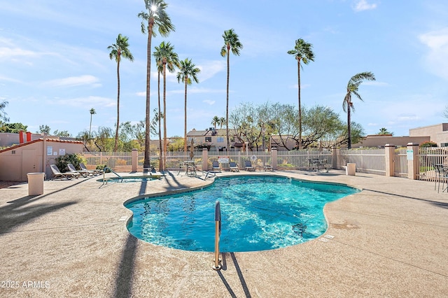 view of swimming pool featuring a patio area