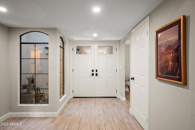 entrance foyer with light wood-type flooring