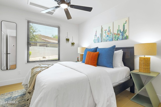 bedroom featuring hardwood / wood-style flooring and ceiling fan