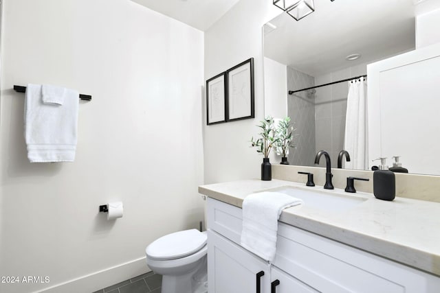 bathroom featuring tile patterned floors, vanity, toilet, and walk in shower