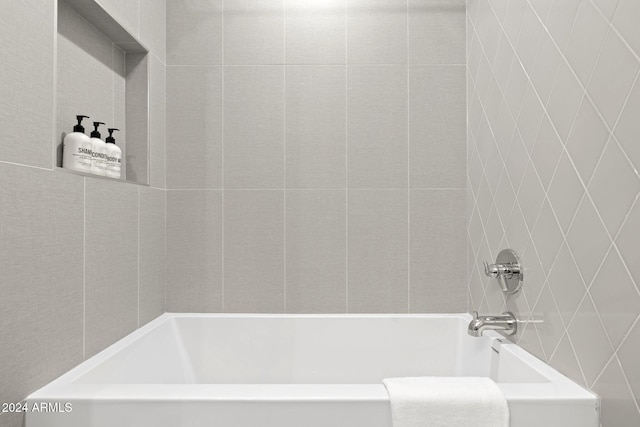 bathroom with a tub to relax in