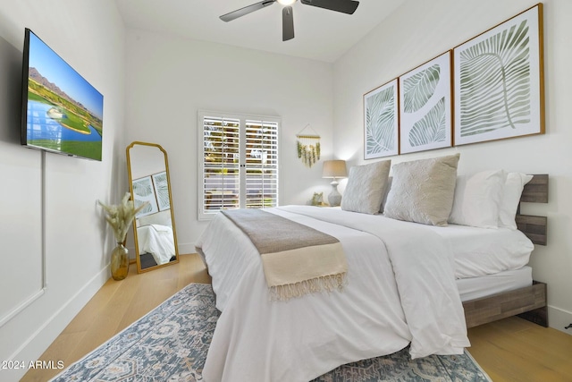 bedroom featuring ceiling fan and light hardwood / wood-style floors