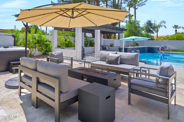 view of patio / terrace featuring pool water feature, a fenced in pool, and an outdoor living space with a fire pit