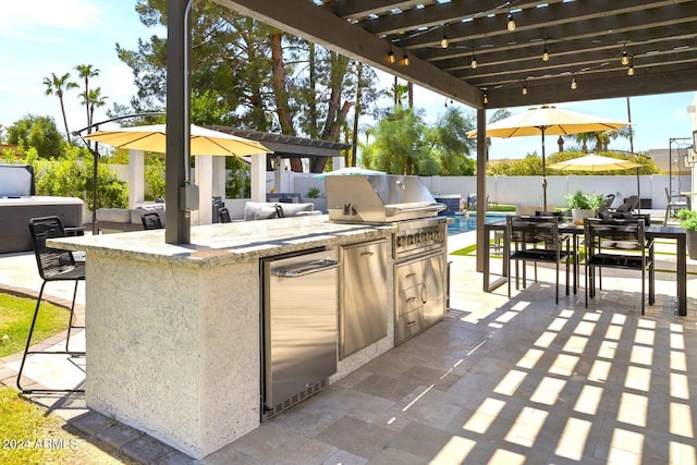 view of patio / terrace with a pergola and area for grilling