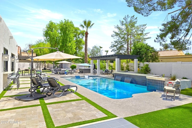 view of swimming pool with a patio area and an outdoor living space