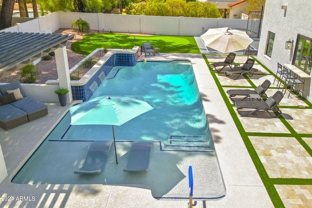 view of swimming pool featuring a patio area