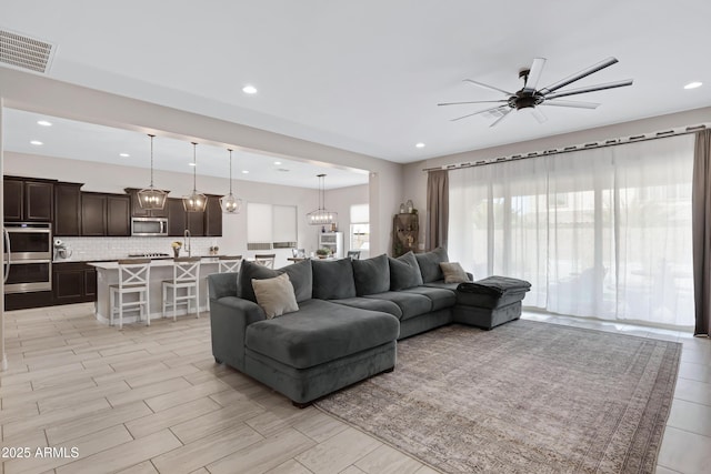 living room with ceiling fan