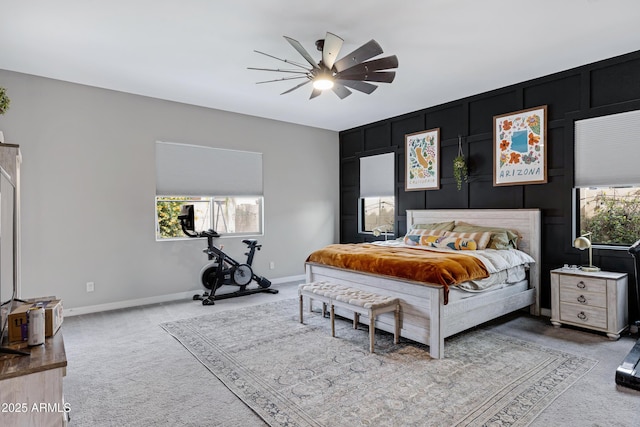 bedroom with multiple windows, carpet floors, and ceiling fan