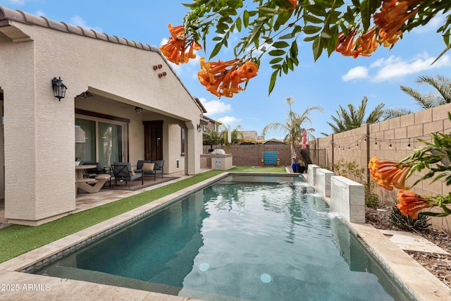 view of pool featuring ceiling fan, a patio, and pool water feature