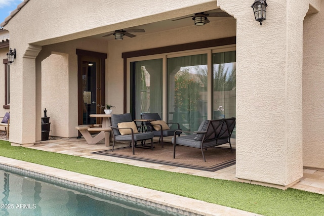 view of patio / terrace featuring ceiling fan