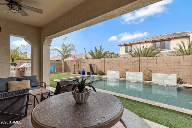 view of swimming pool featuring ceiling fan, a patio area, and pool water feature