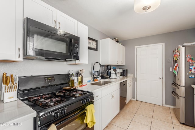 kitchen with light tile patterned flooring, sink, white cabinets, and black appliances