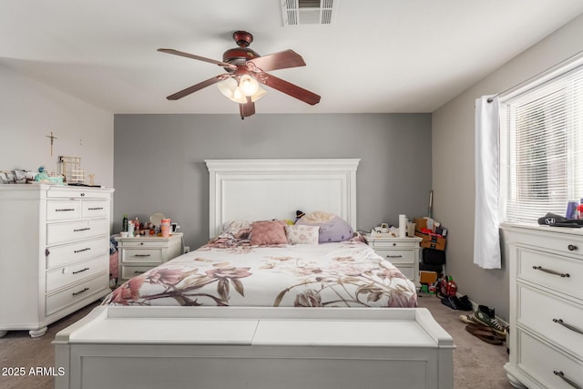 carpeted bedroom featuring ceiling fan