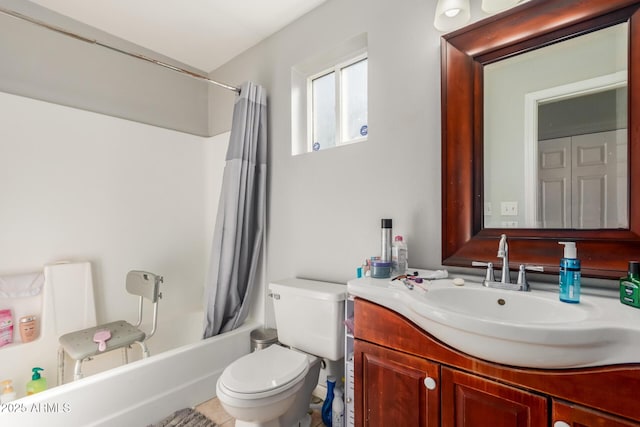 full bathroom with vanity, toilet, and shower / bath combo with shower curtain