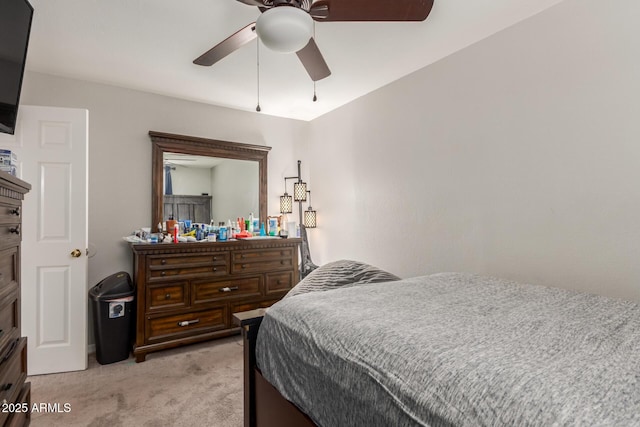 bedroom featuring light carpet and ceiling fan