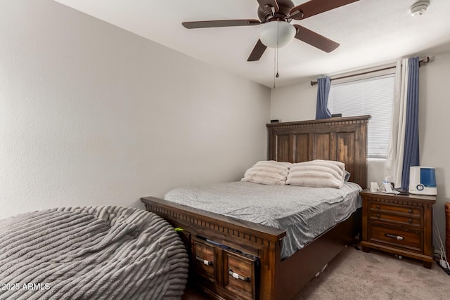 bedroom with light colored carpet and ceiling fan