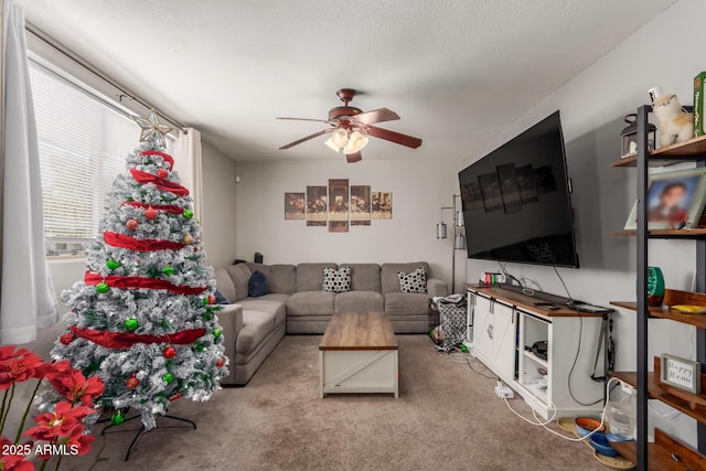 living room with light carpet, a textured ceiling, and ceiling fan