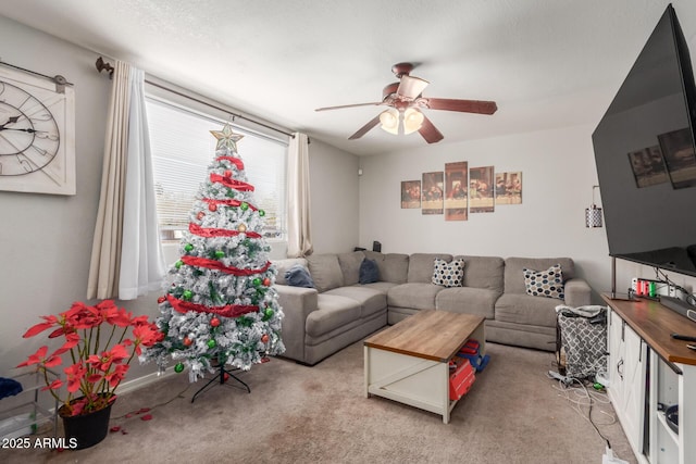 carpeted living room with ceiling fan