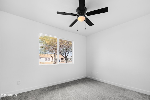 carpeted empty room featuring ceiling fan