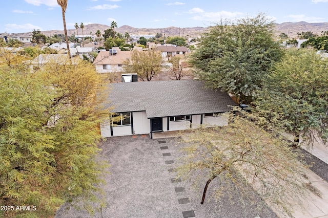 birds eye view of property featuring a mountain view