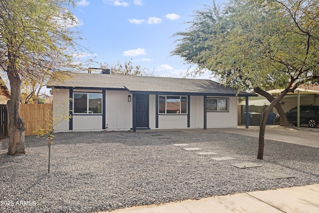 single story home featuring a carport